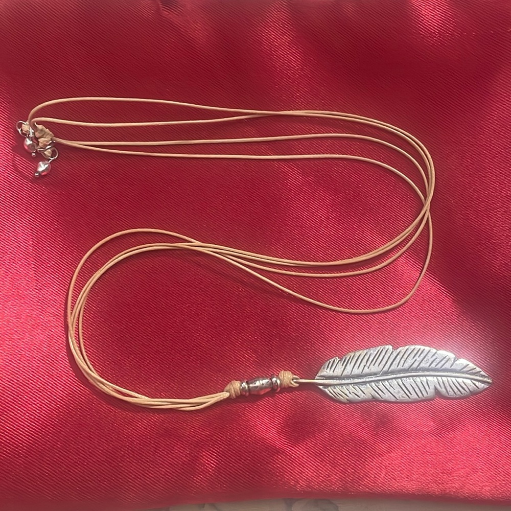Leaf pendant on cord “chain”.